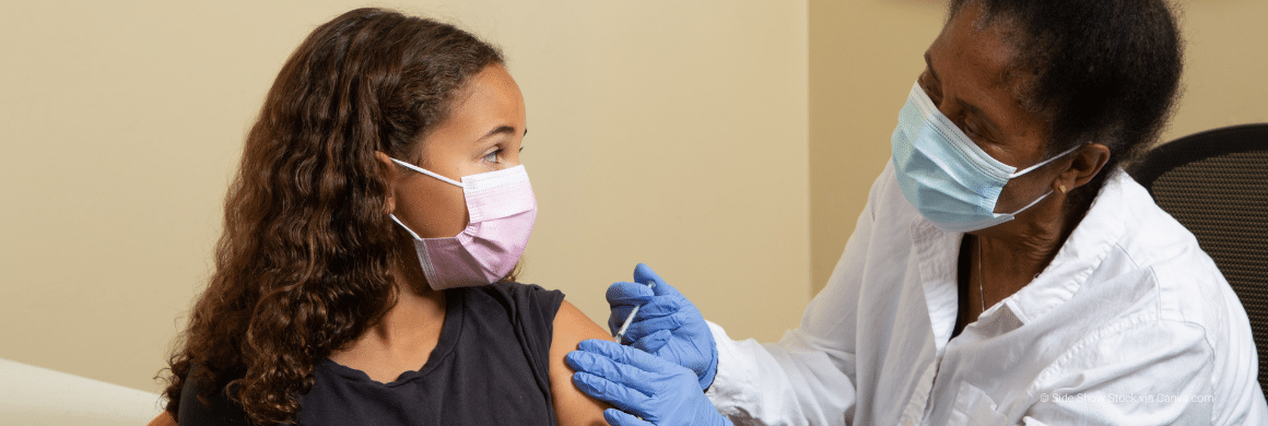 Black Doctor Vaccinating Girl